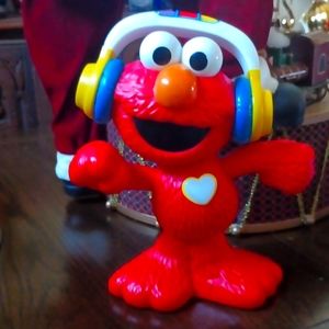 Vintage tickle me Elmo with headphones